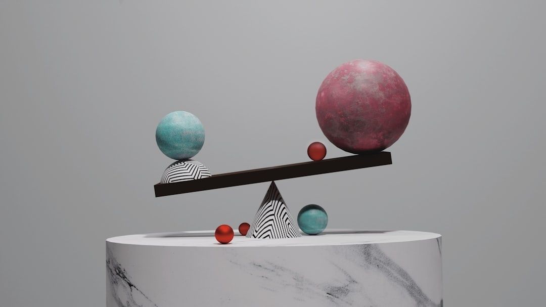 Abstract balance scale with colorful spheres representing portfolio assets